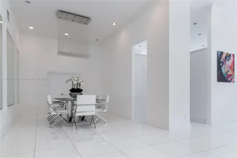 a kitchen with stainless steel appliances granite countertop a stove and a refrigerator