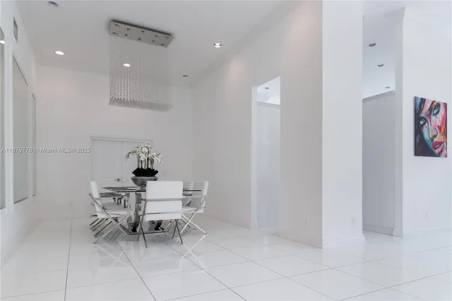 a kitchen with stainless steel appliances granite countertop a stove and a refrigerator