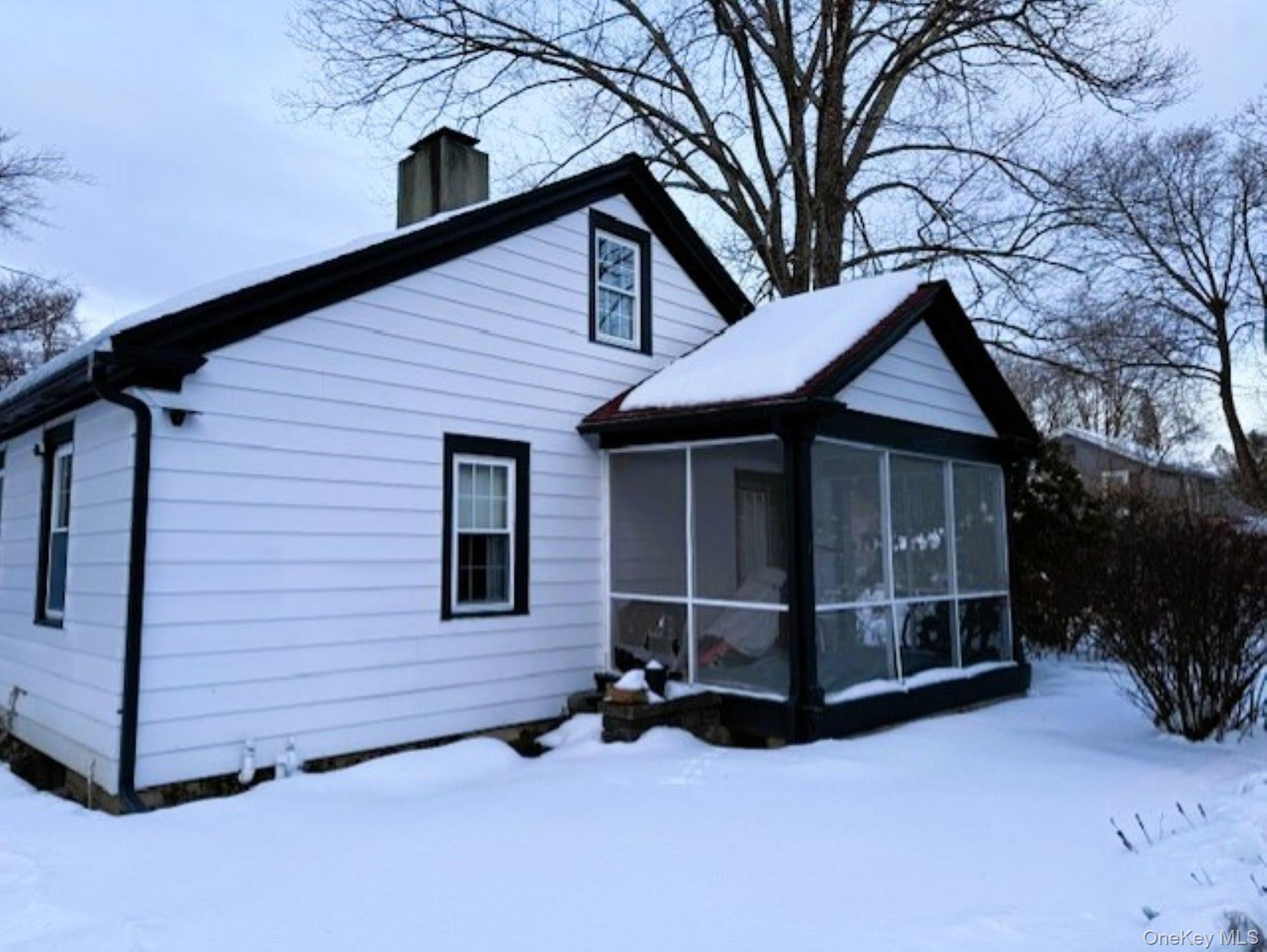 10 Phillips Street Red Hook, NY 12571 - Photo 20 of 27 From the Driveway, screened in porch