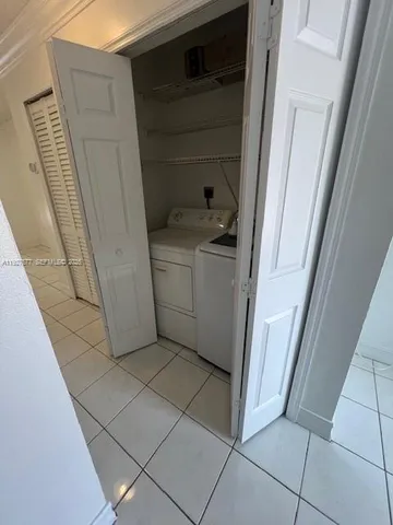 a bathroom with a sink a toilet a mirror and shower