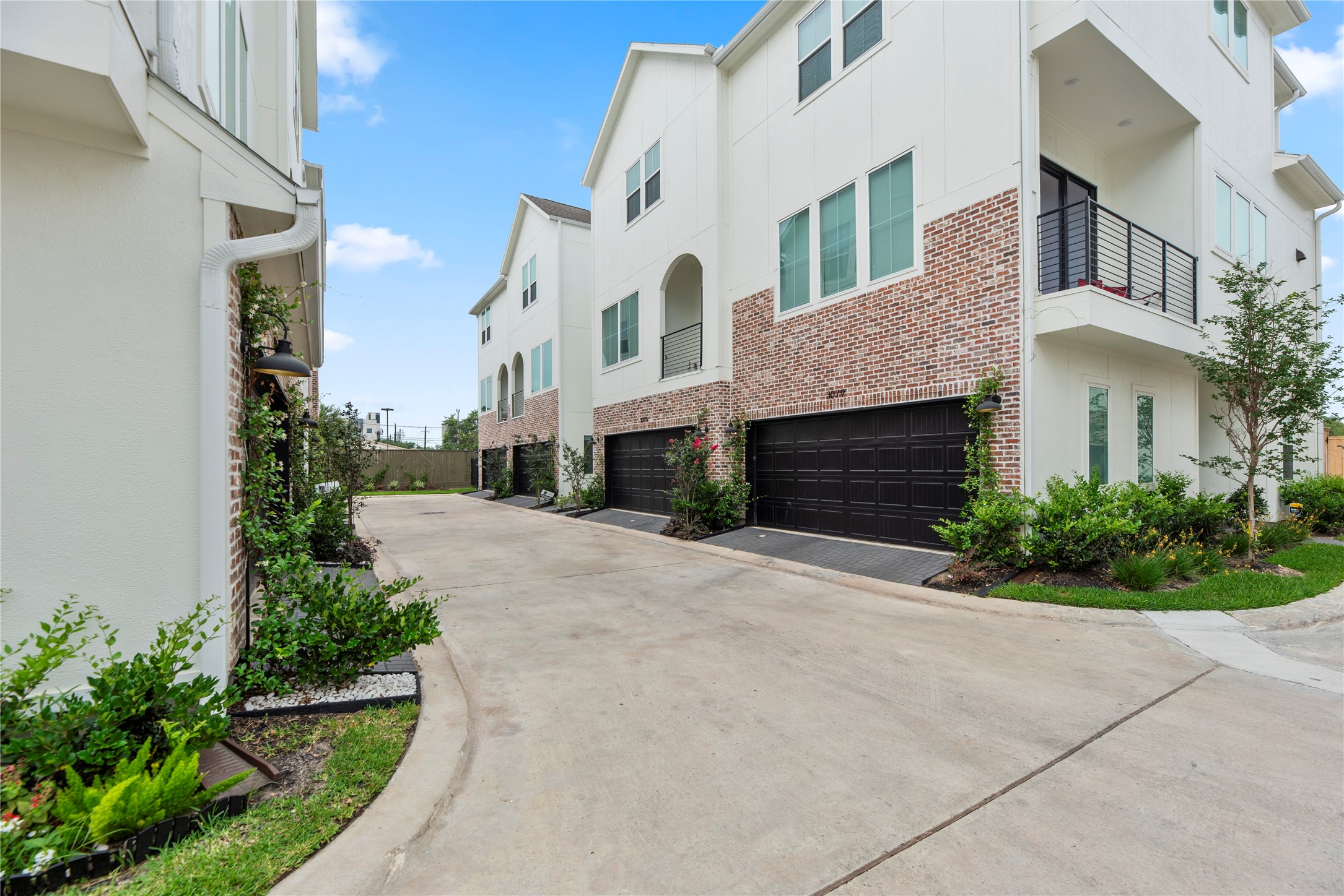 3075 Hicks Street Houston, TX 77007 - Photo 1 of 34 a front view of a house with a yard and a garage