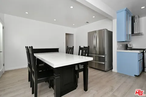 a view of a dining room with furniture and window