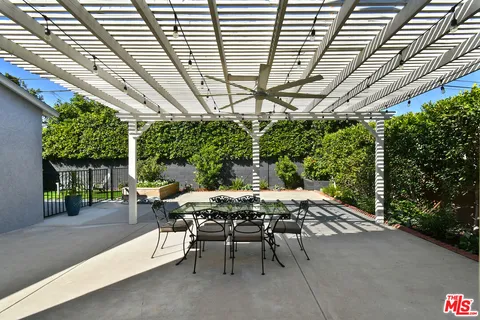a view of a chairs and tables in the patio