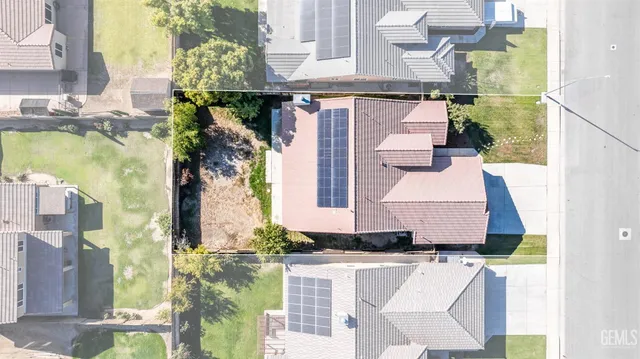 a aerial view of a house with a swimming pool