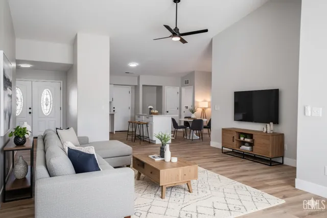 a living room with furniture and a flat screen tv