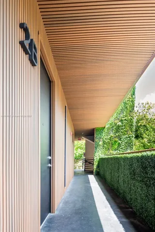 a view of a porch with wooden floor