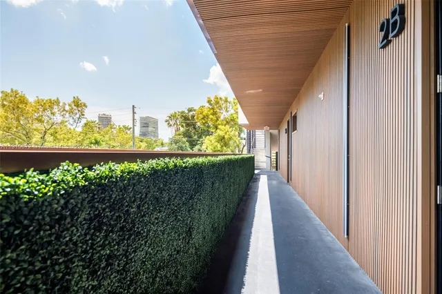 a view of a balcony with wooden fence