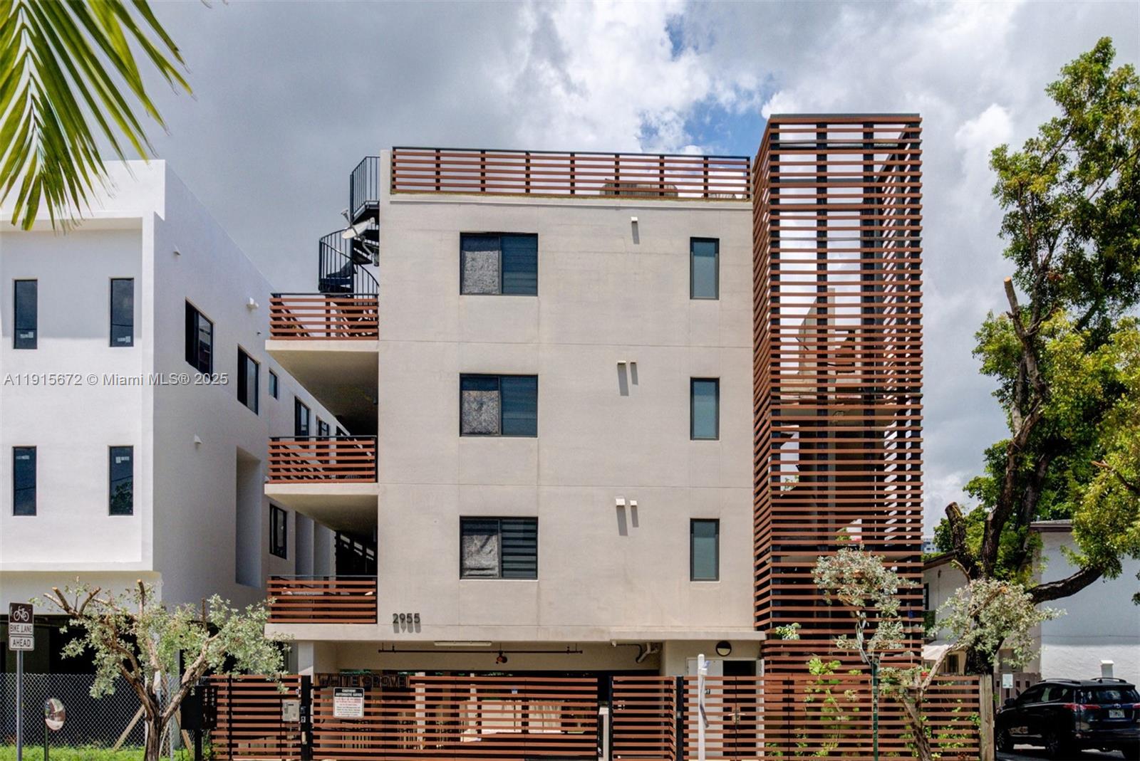 2955 Bird Avenue, Unit 1B Miami, FL 33133 - Photo 13 of 15 a view of a large white building