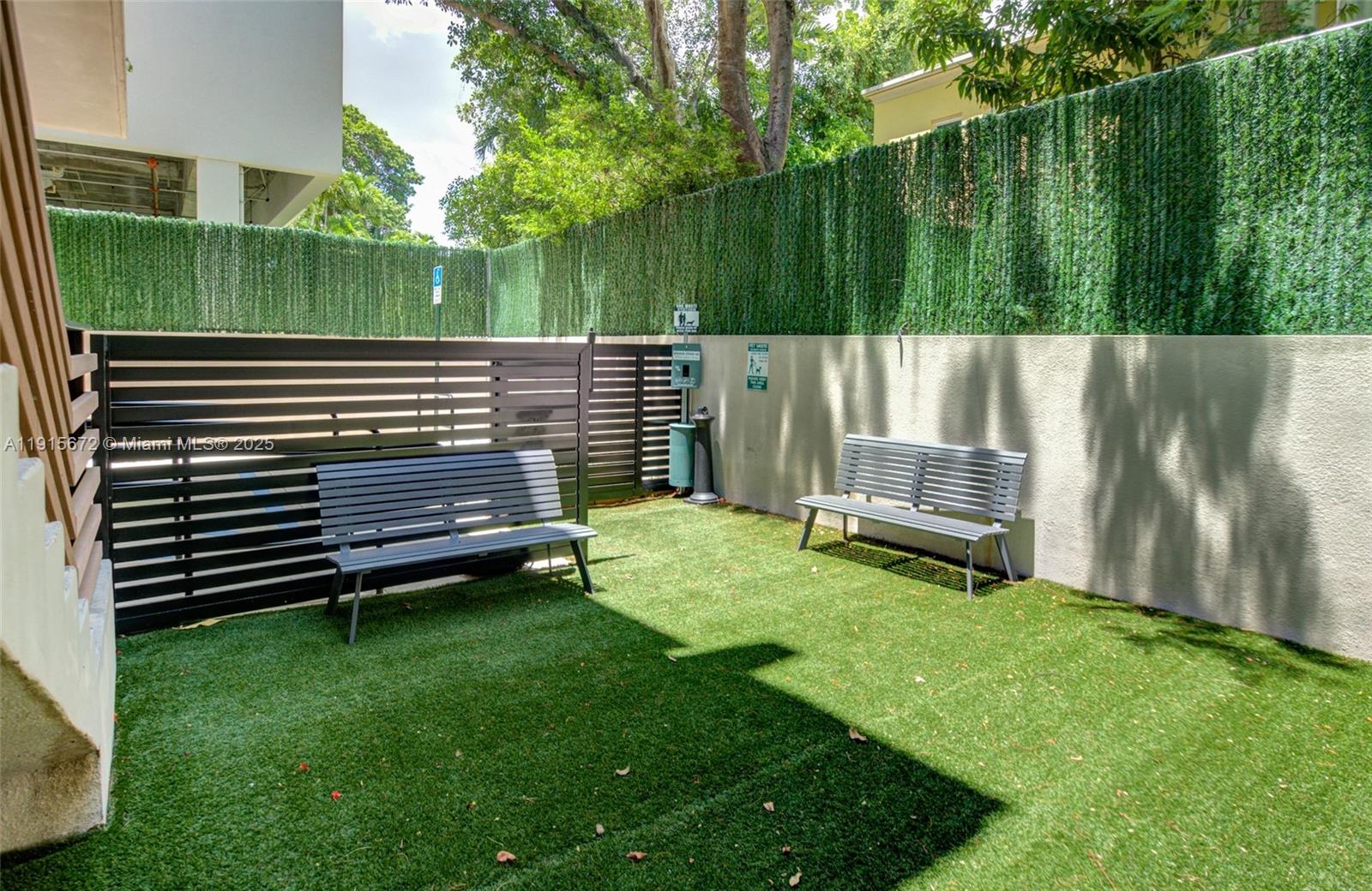 2955 Bird Avenue, Unit 1B Miami, FL 33133 - Photo 14 of 15 a view of a park with bench and wooden fence