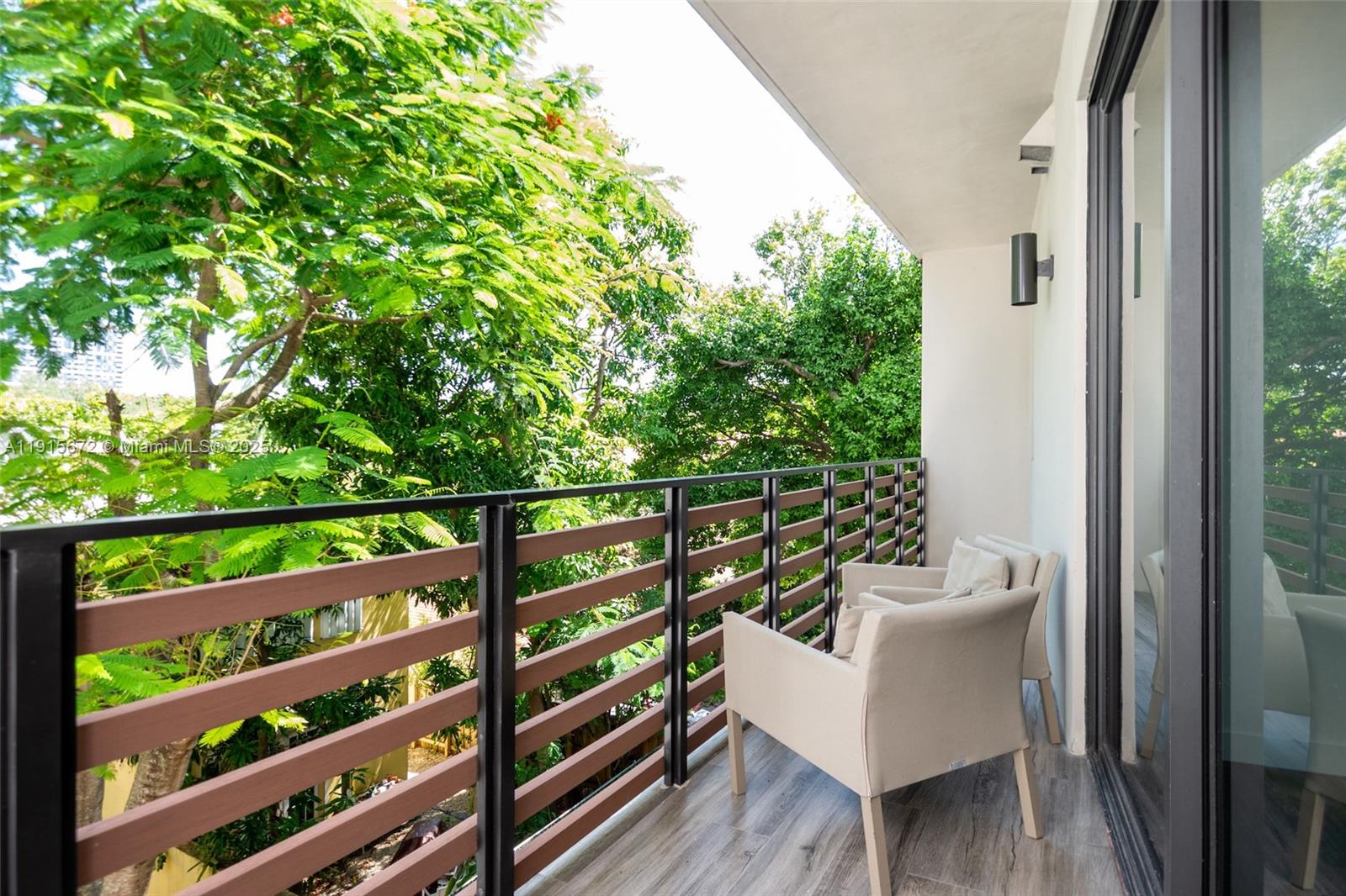 2955 Bird Avenue, Unit 1B Miami, FL 33133 - Photo 10 of 15 a view of a balcony with wooden floor