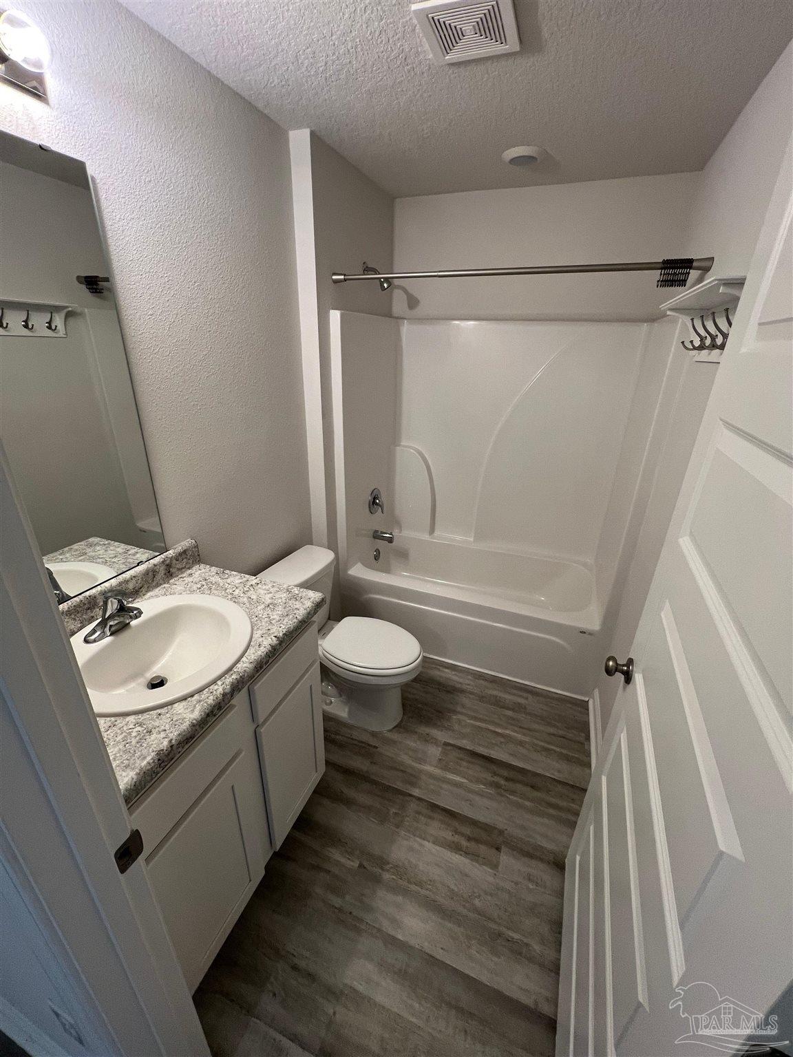 6235 June Bug Drive Milton, FL 32583 - Photo 13 of 20 a bathroom with a sink toilet double vanity and shower