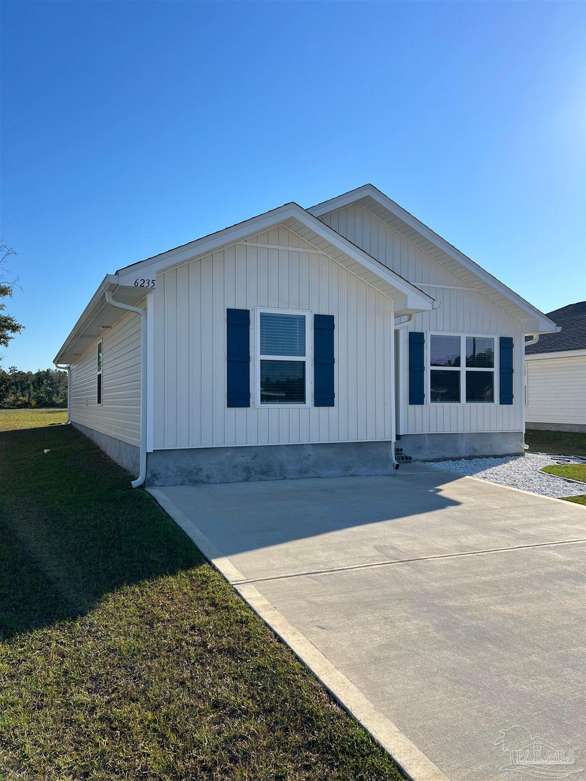 6235 June Bug Drive Milton, FL 32583 - Photo 2 of 20 a view of a backyard of a house