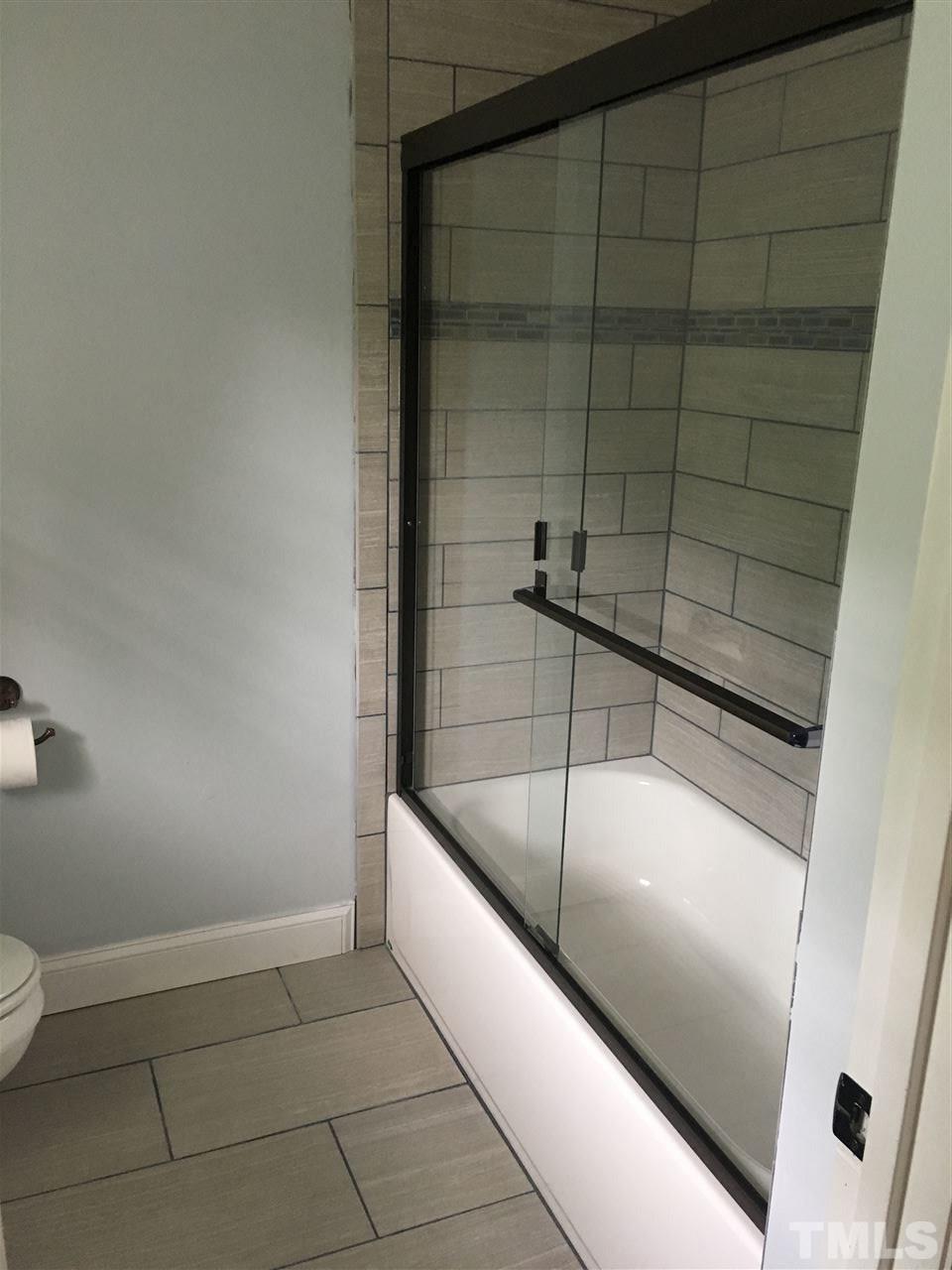 9740 South Lowell Road Bahama, NC 27503 - Photo 17 of 17 a bathroom with a bathtub and shower