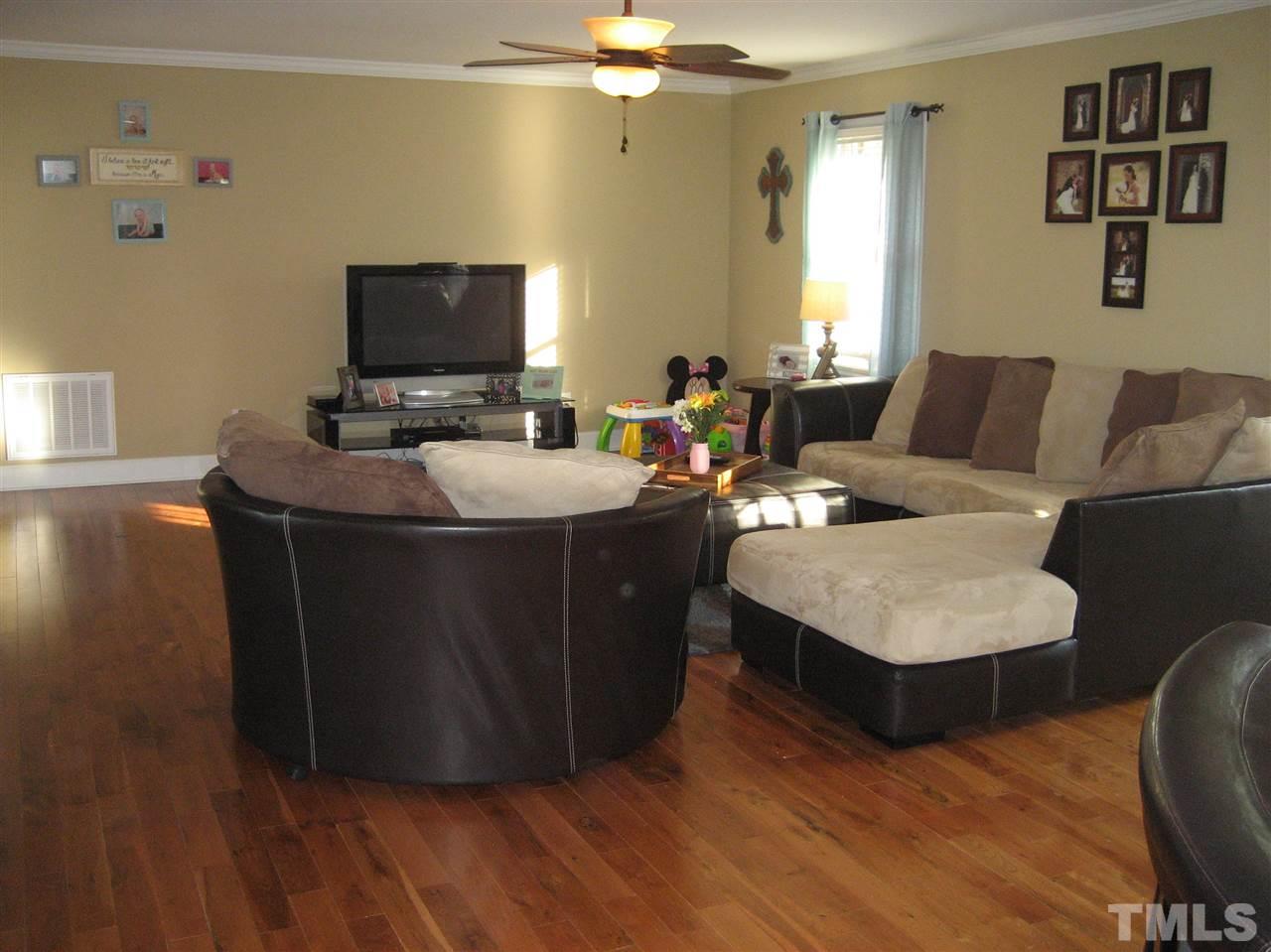 9740 South Lowell Road Bahama, NC 27503 - Photo 3 of 17 a living room with furniture and a flat screen tv