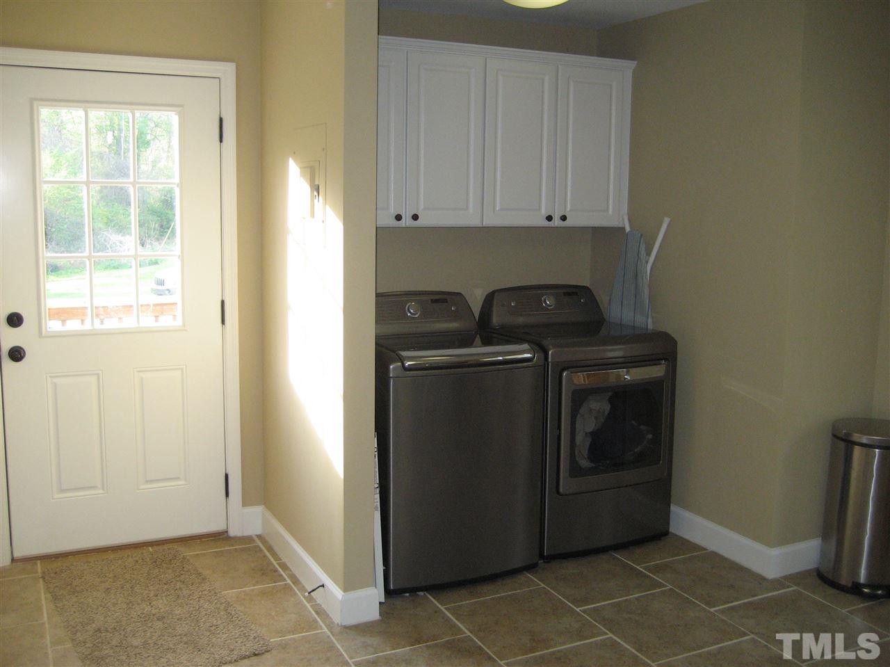 9740 South Lowell Road Bahama, NC 27503 - Photo 6 of 17 a utility room with dryer and washer