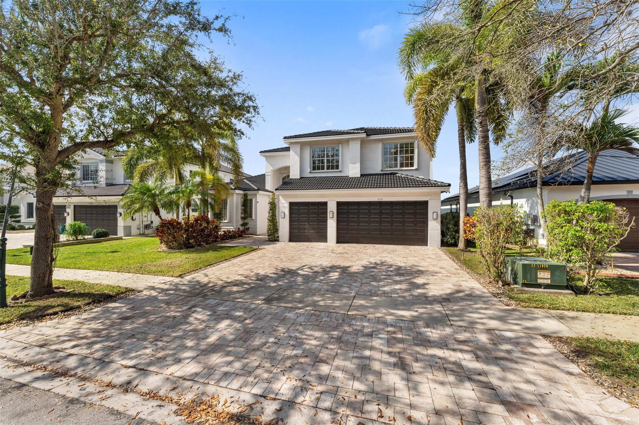 5318 Southwest 195th Terrace Miramar, FL 33029 - Photo 1 of 67 a front view of a house with a yard and garage