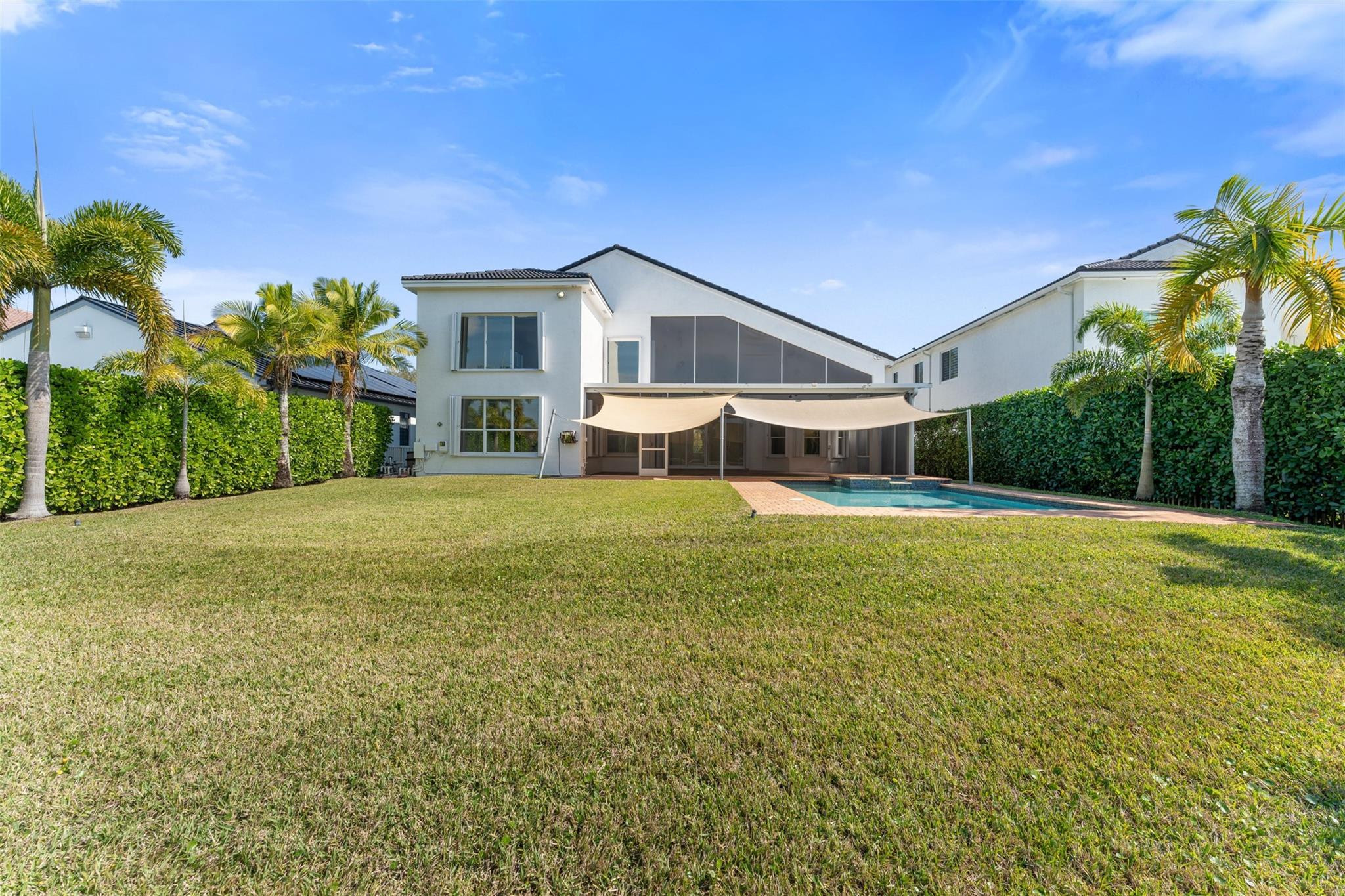 5318 Southwest 195th Terrace Miramar, FL 33029 - Photo 27 of 67 a front view of house with yard and swimming pool