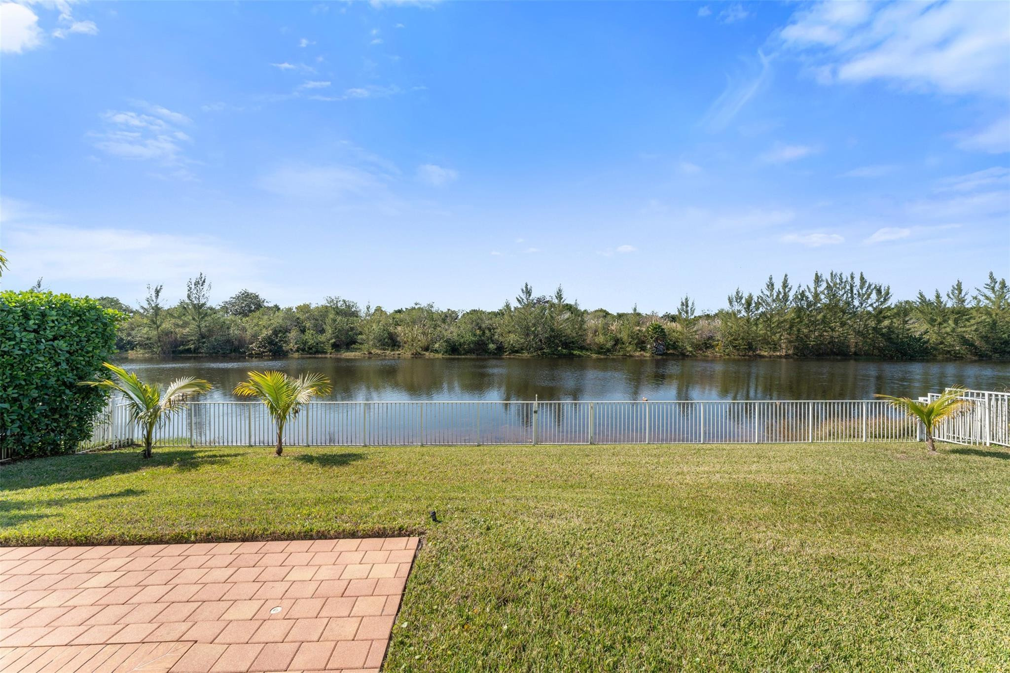 5318 Southwest 195th Terrace Miramar, FL 33029 - Photo 31 of 67 a view of a lake with houses in the back