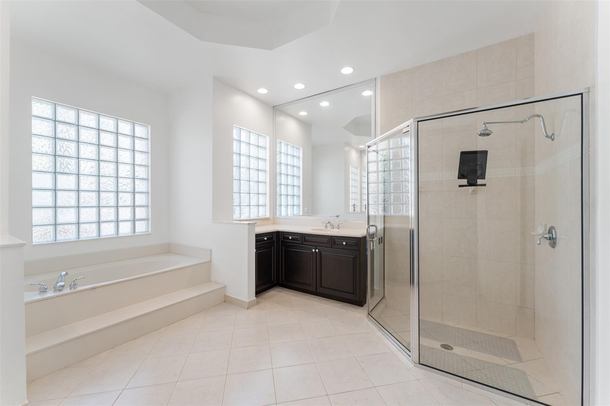 5318 Southwest 195th Terrace Miramar, FL 33029 - Photo 36 of 67 a bathroom with a bathtub shower and a sink