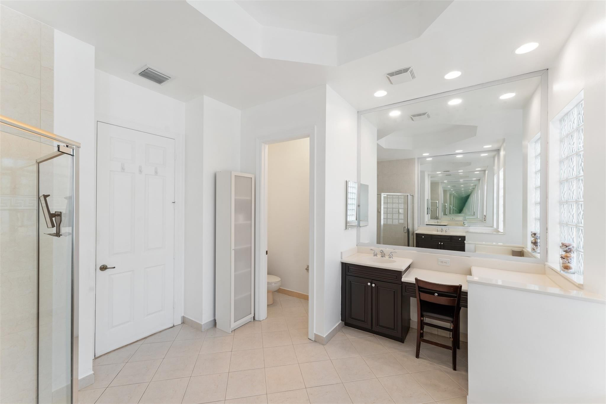 5318 Southwest 195th Terrace Miramar, FL 33029 - Photo 37 of 67 a large bathroom with a double vanity sink a mirror and a shower