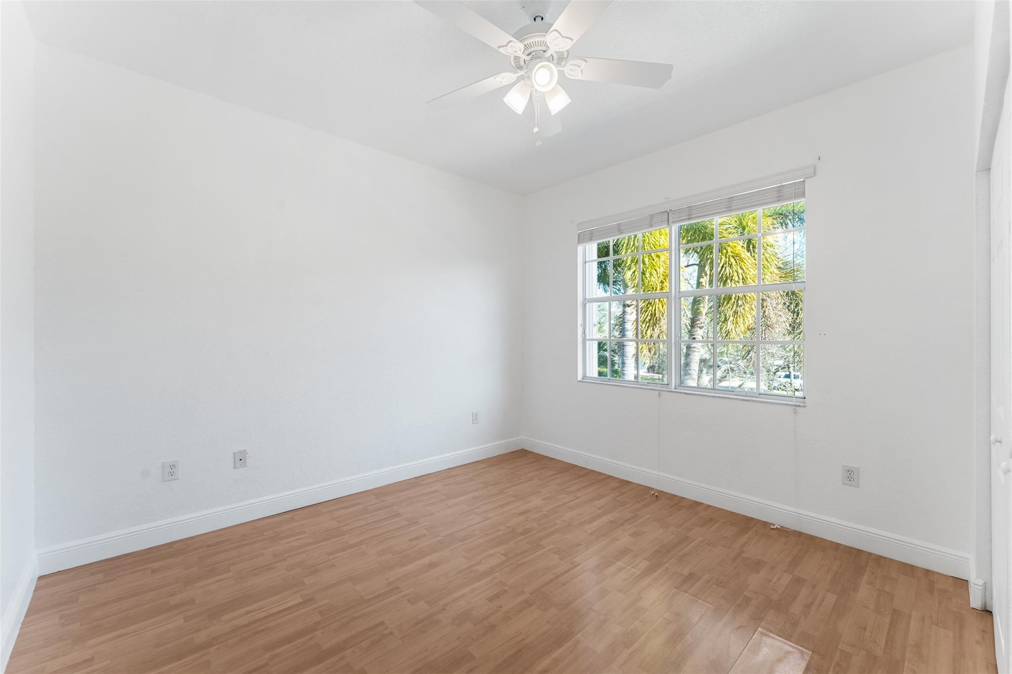 5318 Southwest 195th Terrace Miramar, FL 33029 - Photo 48 of 67 an empty room with a window and a fan