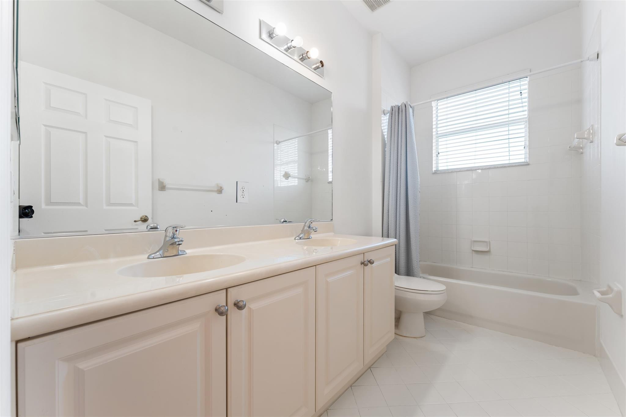 5318 Southwest 195th Terrace Miramar, FL 33029 - Photo 50 of 67 a bathroom with a sink a toilet and shower