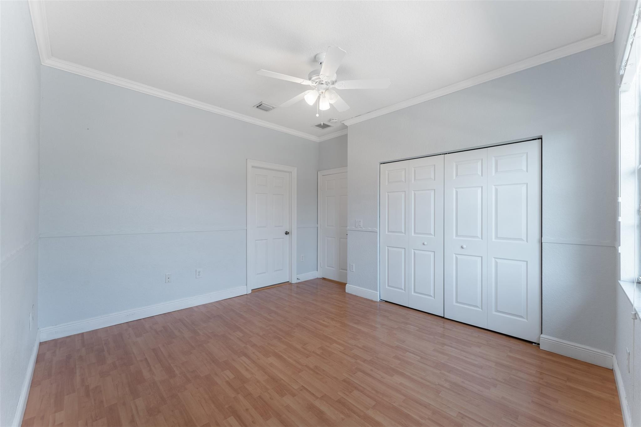 5318 Southwest 195th Terrace Miramar, FL 33029 - Photo 52 of 67 a view of an empty room with wooden floor