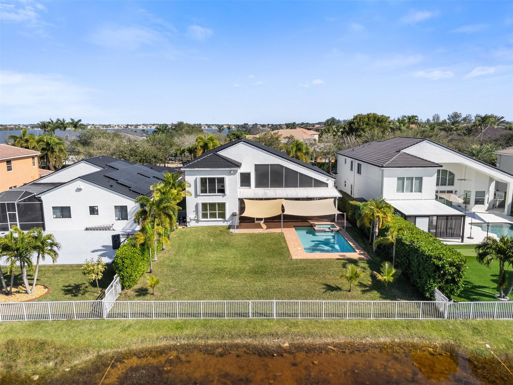 5318 Southwest 195th Terrace Miramar, FL 33029 - Photo 59 of 67 a view of house with garden space and swimming pool