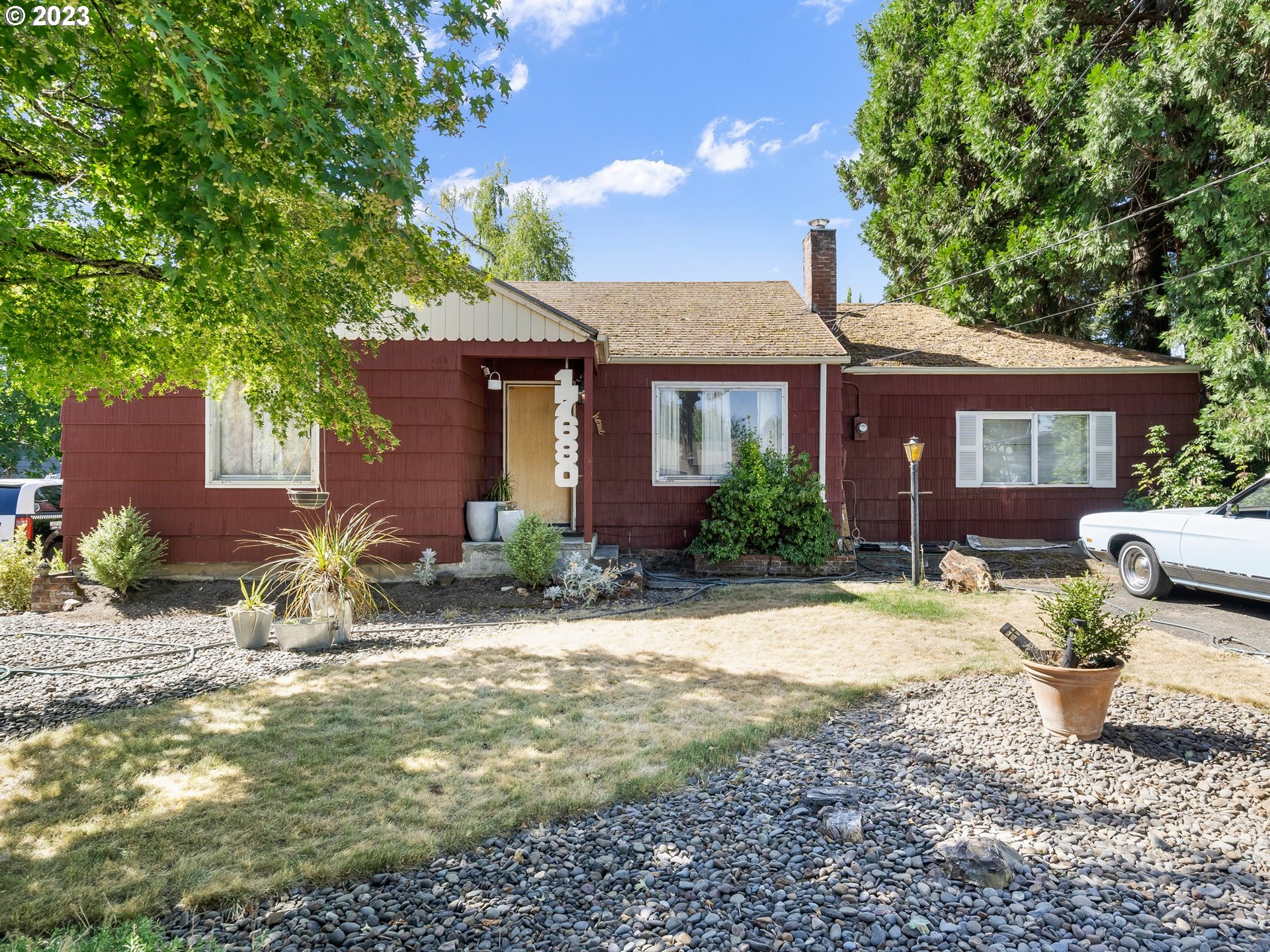 a front view of a house with garden