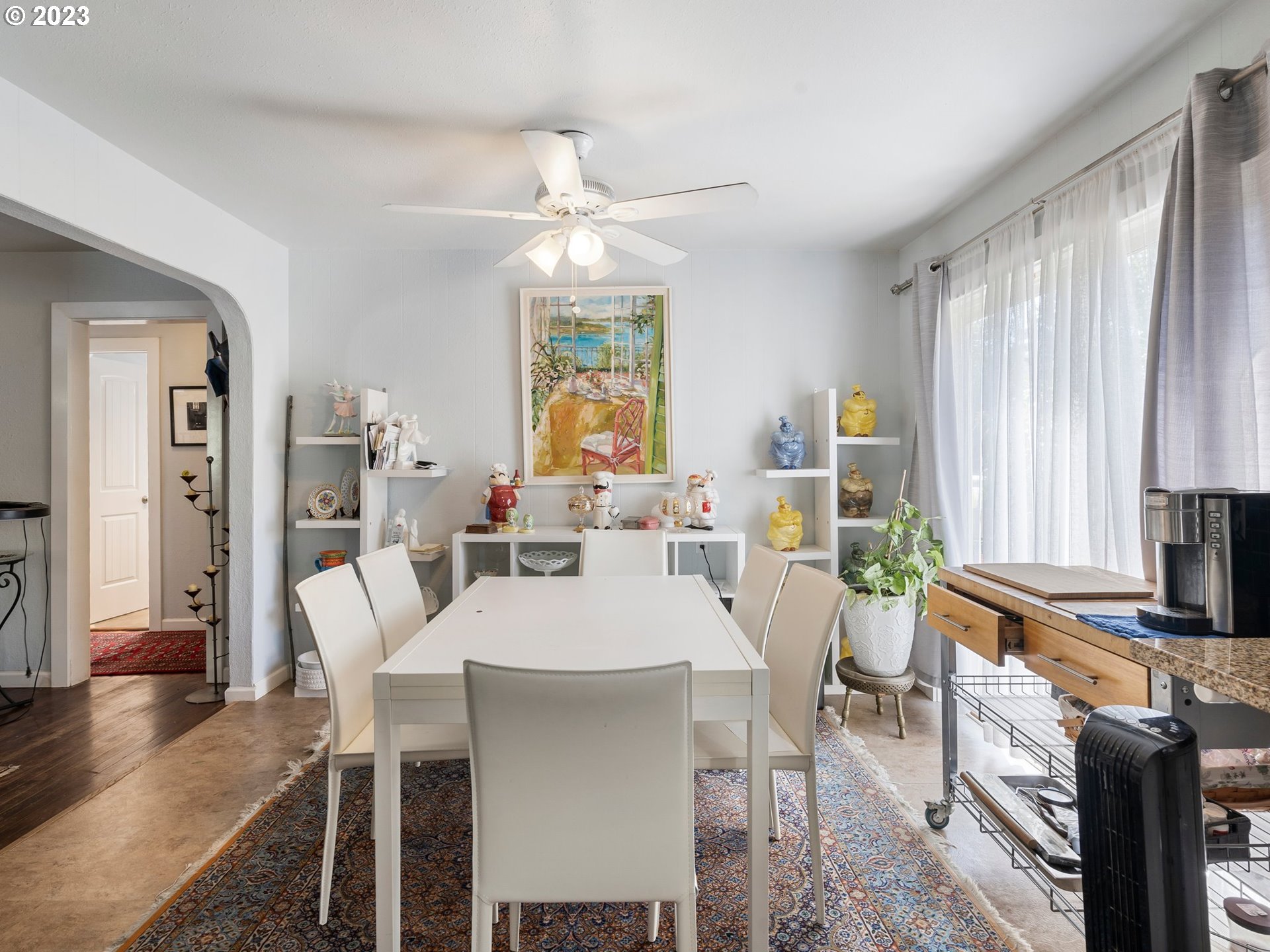 17680 Southwest Alexander Street Beaverton, OR 97003 - Photo 12 of 38 a view of a dining room with furniture window and wooden floor