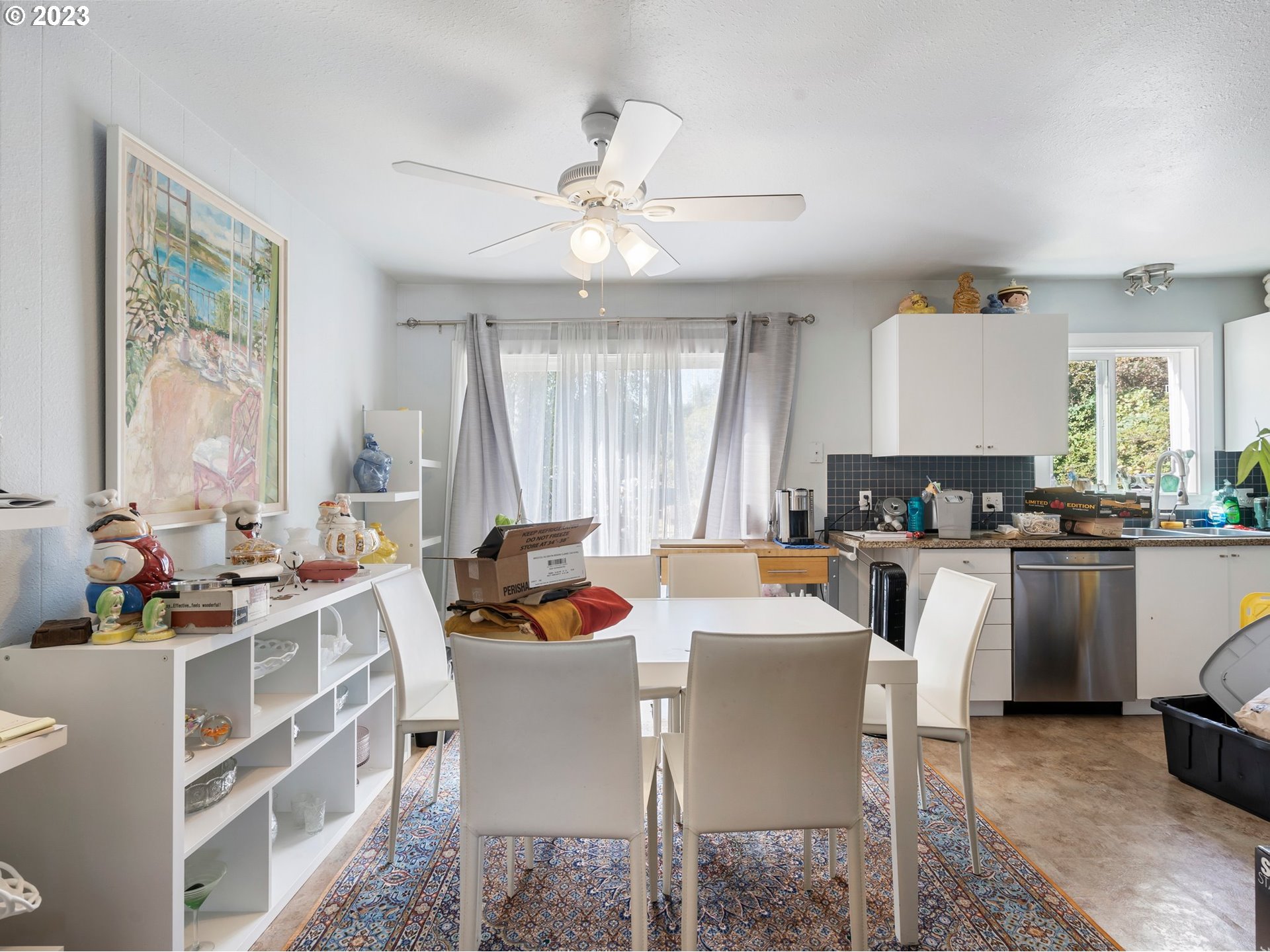 17680 Southwest Alexander Street Beaverton, OR 97003 - Photo 13 of 38 a dining room with a window a sink and kitchen view