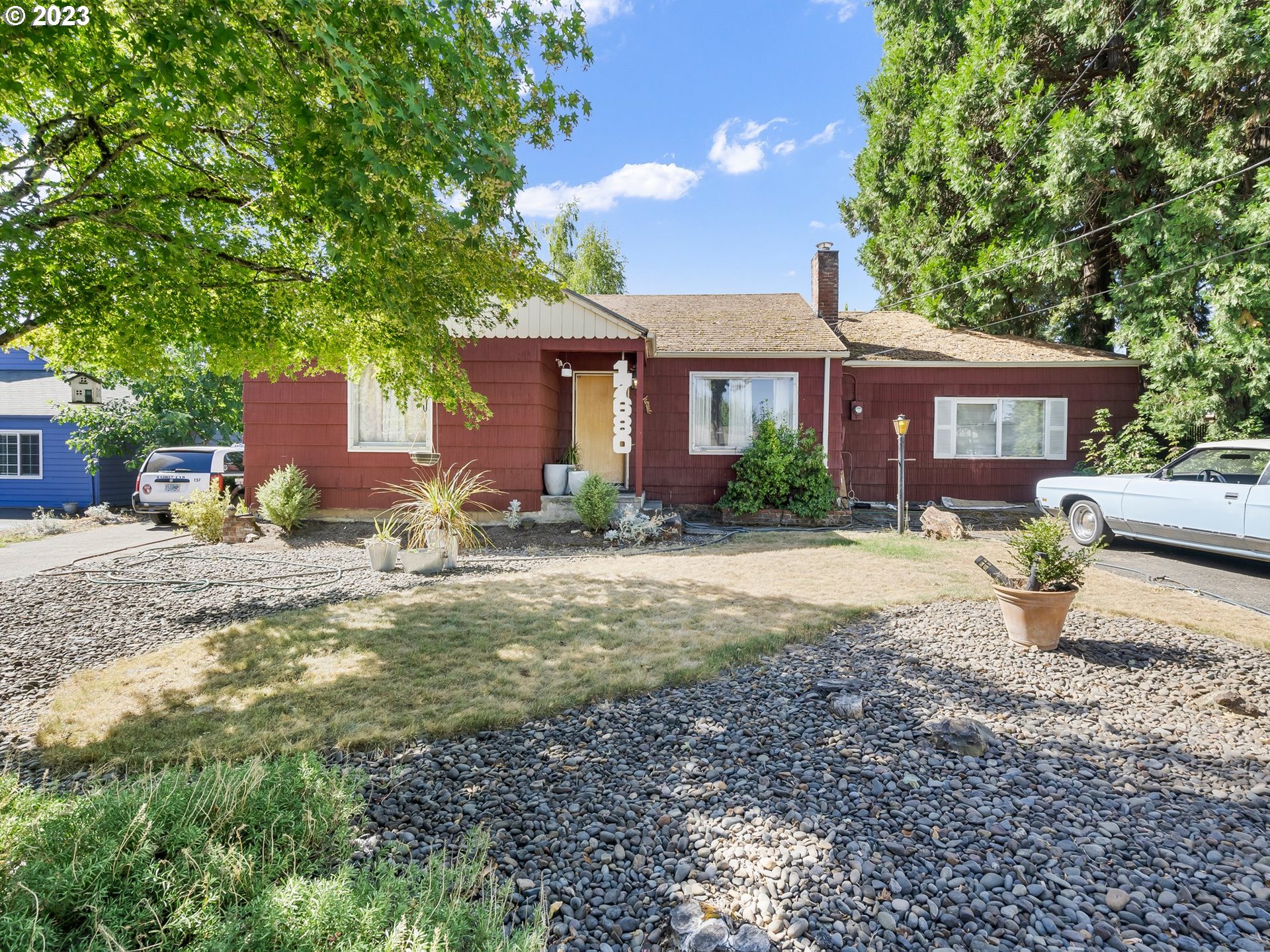 17680 Southwest Alexander Street Beaverton, OR 97003 - Photo 2 of 38 a front view of a house with garden