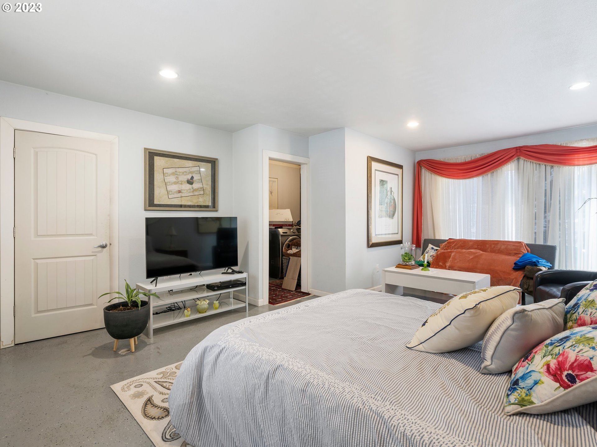 17680 Southwest Alexander Street Beaverton, OR 97003 - Photo 23 of 38 a bedroom with a bed and a flat screen tv