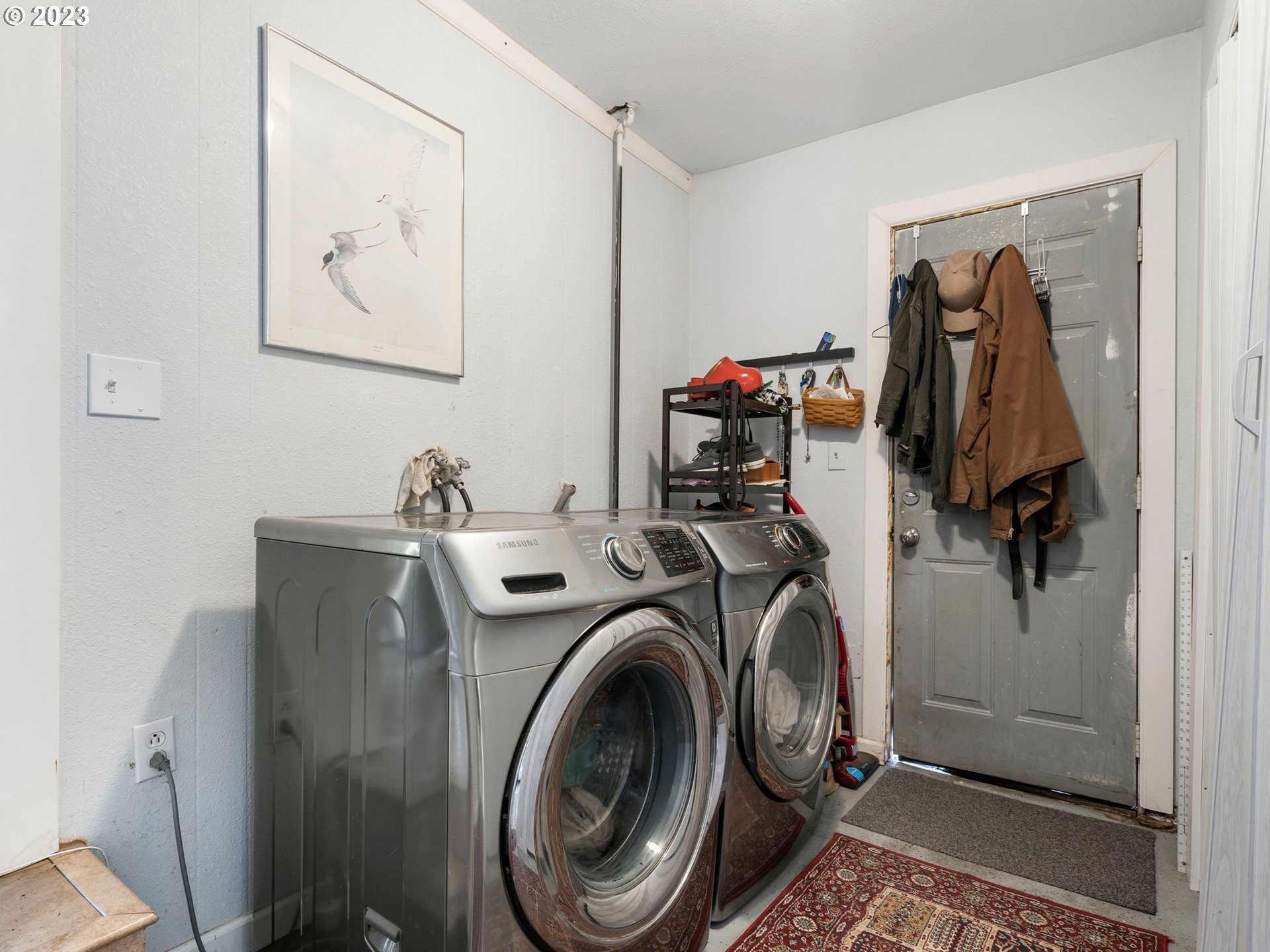 17680 Southwest Alexander Street Beaverton, OR 97003 - Photo 29 of 38 a view of walk in closet with clothes and shoes