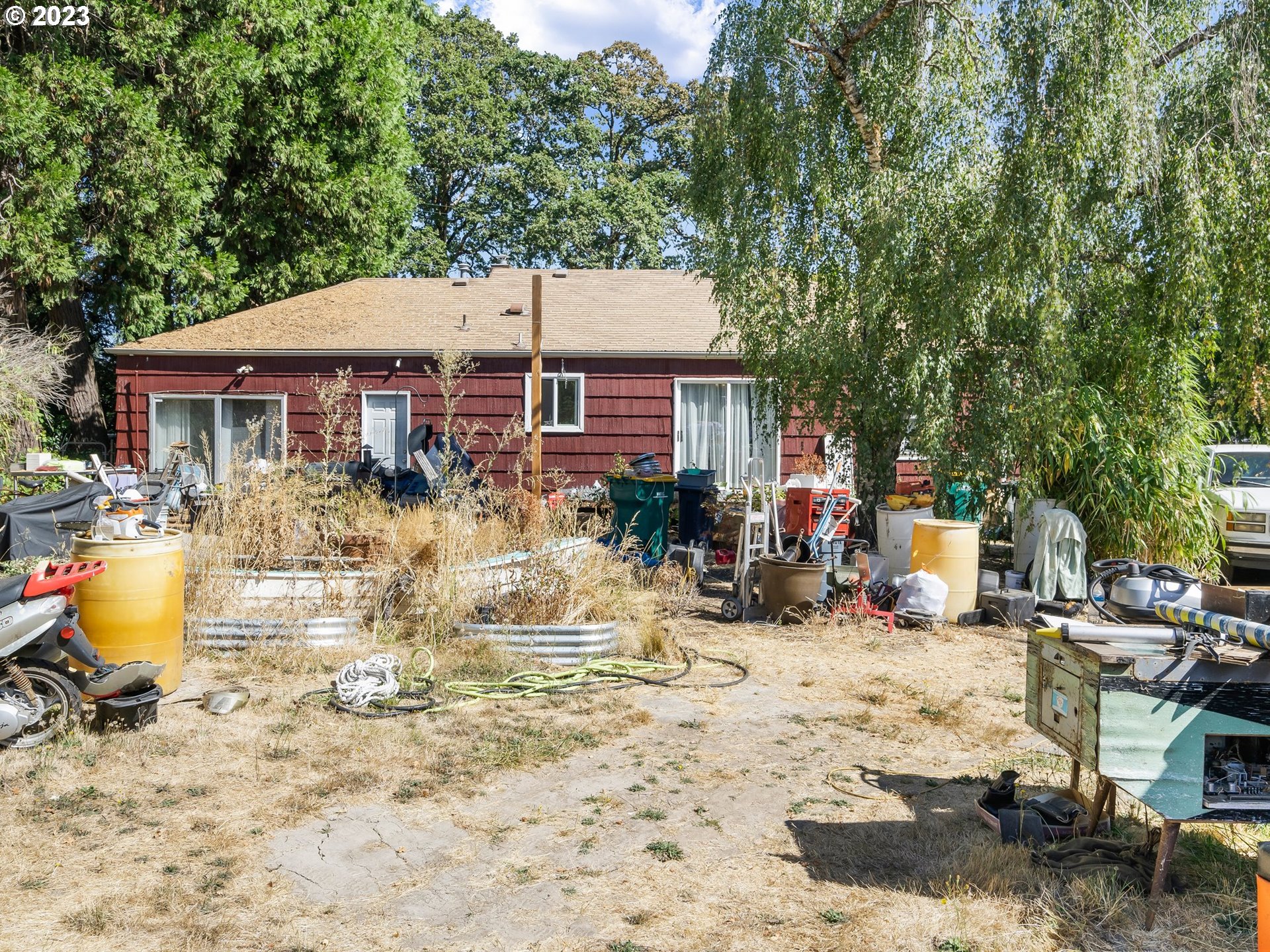 17680 Southwest Alexander Street Beaverton, OR 97003 - Photo 30 of 38 a view of a lounge chair and table in the backyard