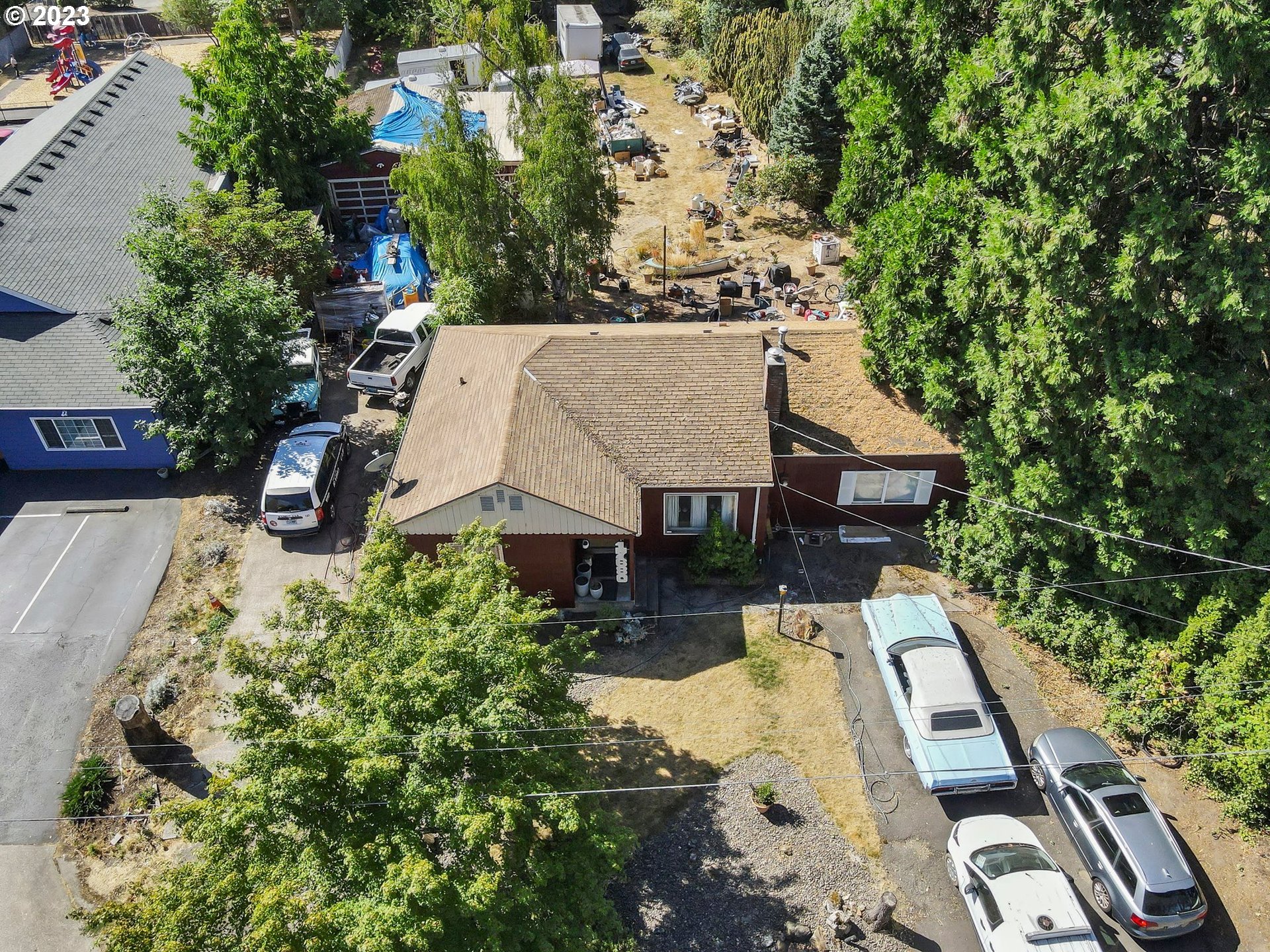 17680 Southwest Alexander Street Beaverton, OR 97003 - Photo 32 of 38 an aerial view of a house with swimming pool and garden