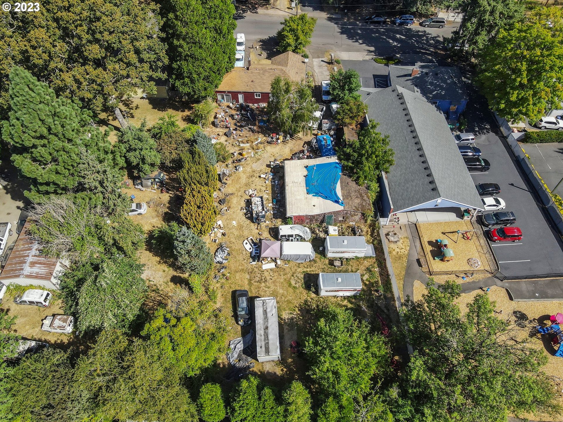 17680 Southwest Alexander Street Beaverton, OR 97003 - Photo 38 of 38 an aerial view of a house with a yard and trees