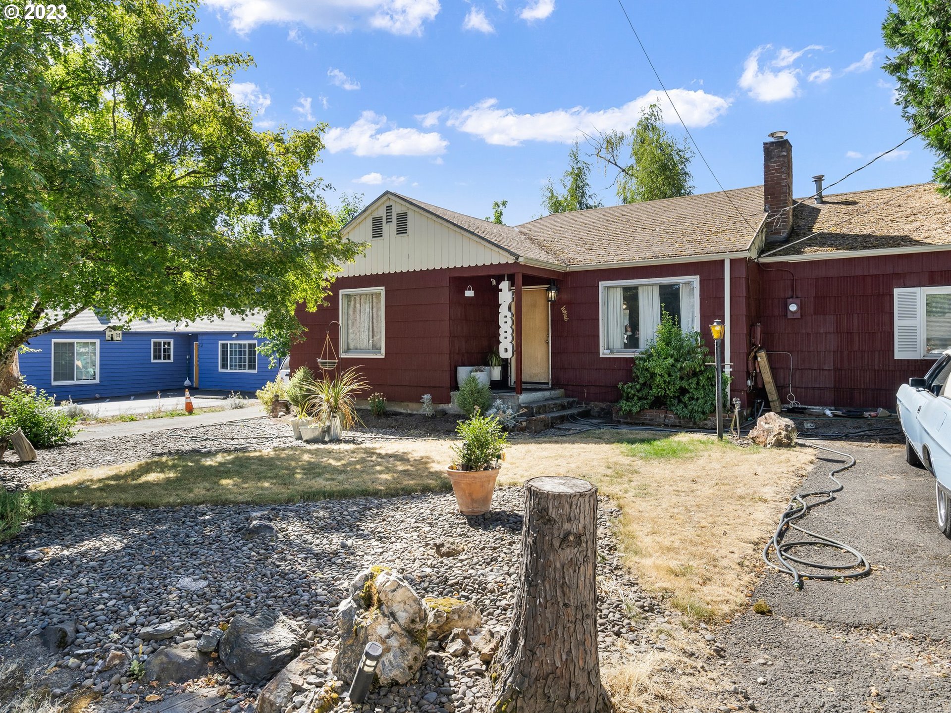 17680 Southwest Alexander Street Beaverton, OR 97003 - Photo 4 of 38 a front view of a house with garden