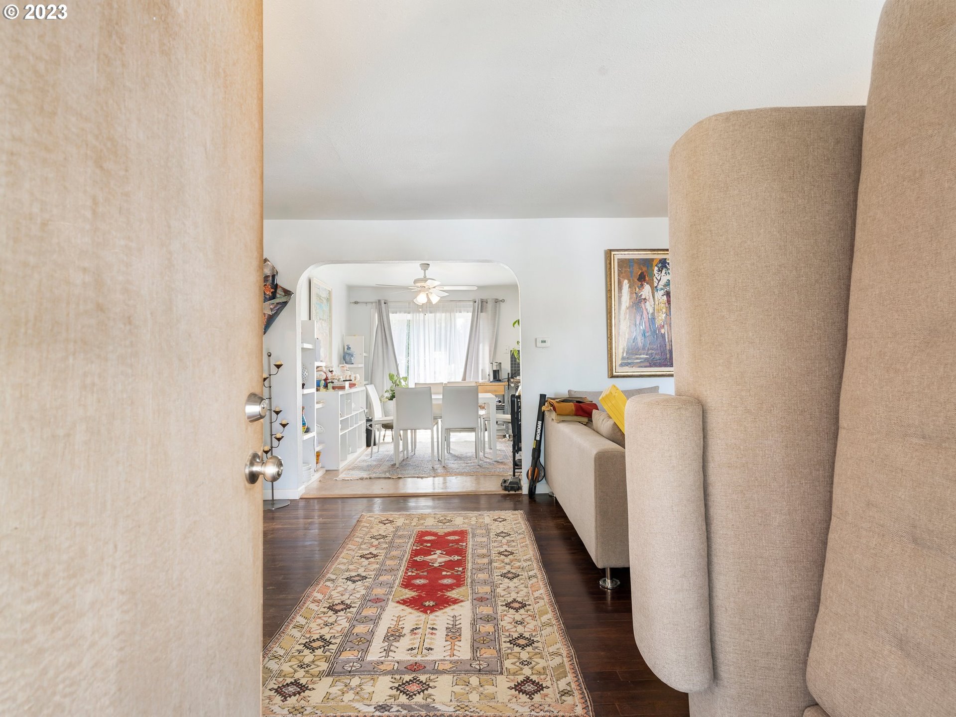 17680 Southwest Alexander Street Beaverton, OR 97003 - Photo 6 of 38 a hallway with white cabinets and wooden floor
