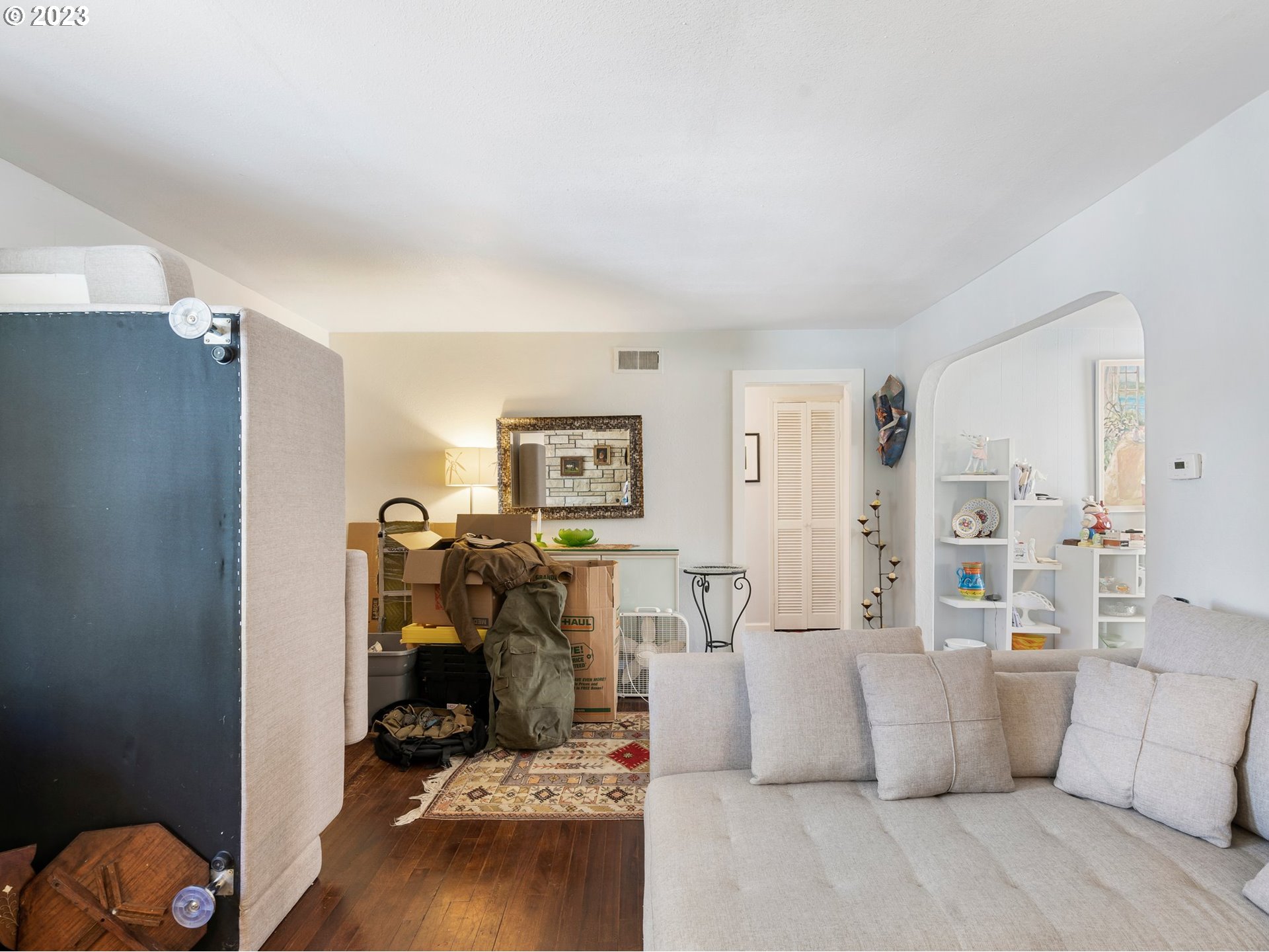 17680 Southwest Alexander Street Beaverton, OR 97003 - Photo 10 of 38 a living room with furniture and wooden floor