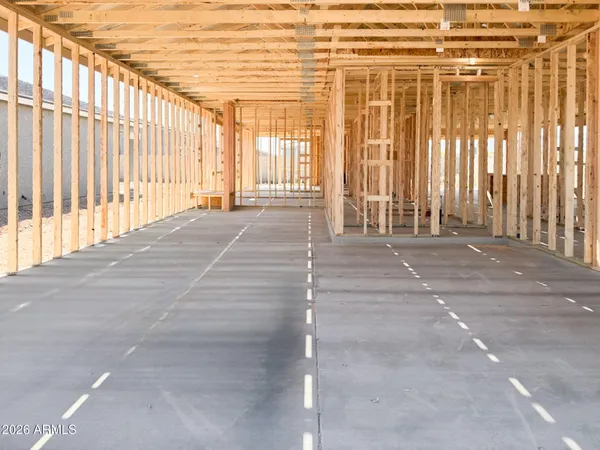 a bedroom with a bed and a chair