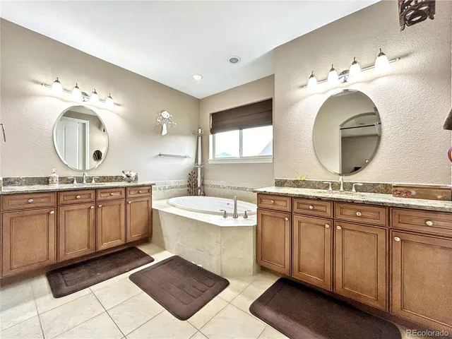a spacious bathroom with a double vanity sink mirror and a