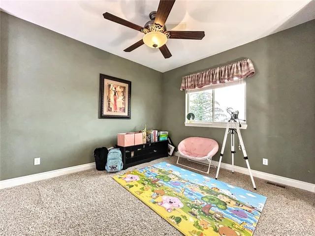 a bedroom with bed and a window