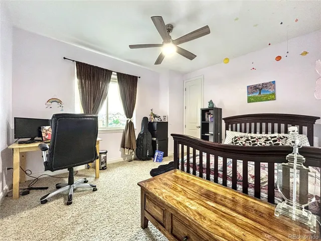 a bedroom with furniture and a window