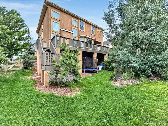 a front view of a house with a yard and porch