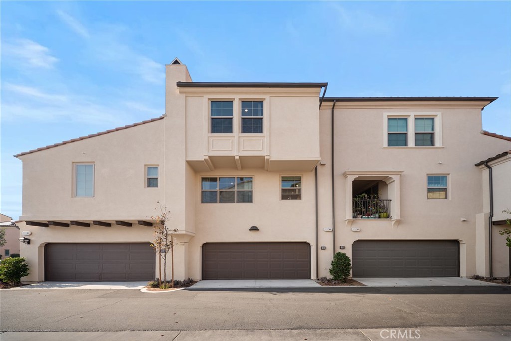 a front view of a house with garage