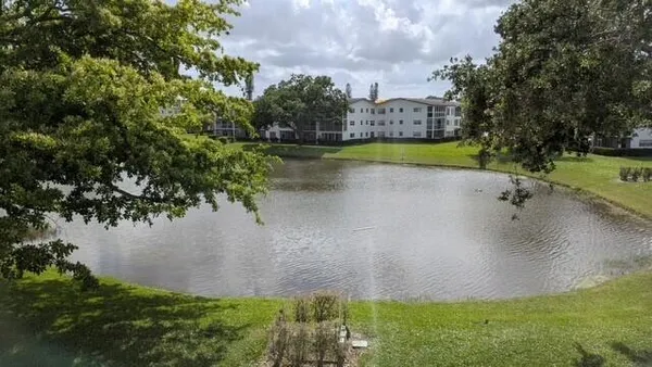 a view of a lake with a yard
