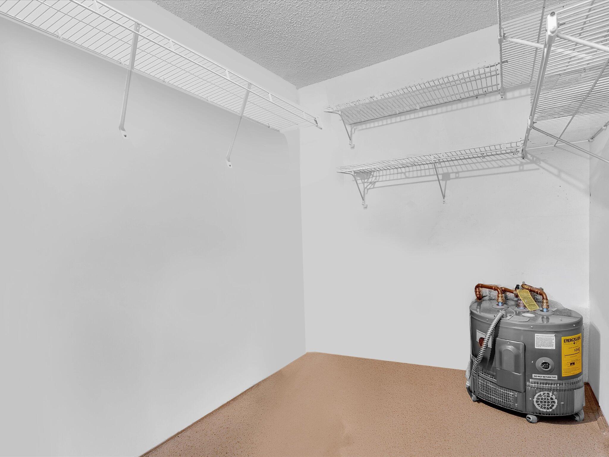 288 Fanshaw Drive, Unit G Boca Raton, FL 33434 - Photo 23 of 49 a view of storage and utility room with racks on the wall
