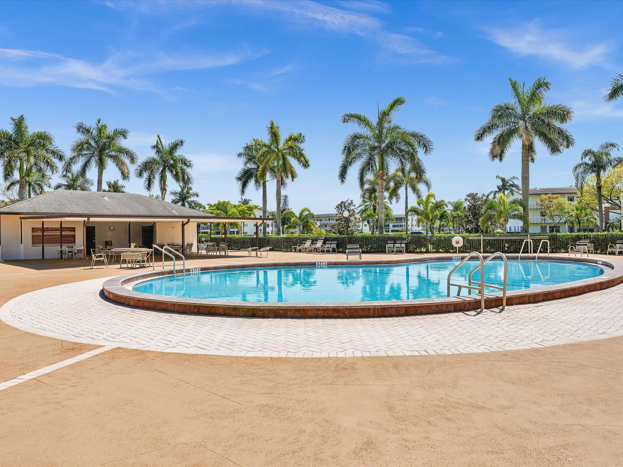 288 Fanshaw Drive, Unit G Boca Raton, FL 33434 - Photo 28 of 49 a view of swimming pool with a yard