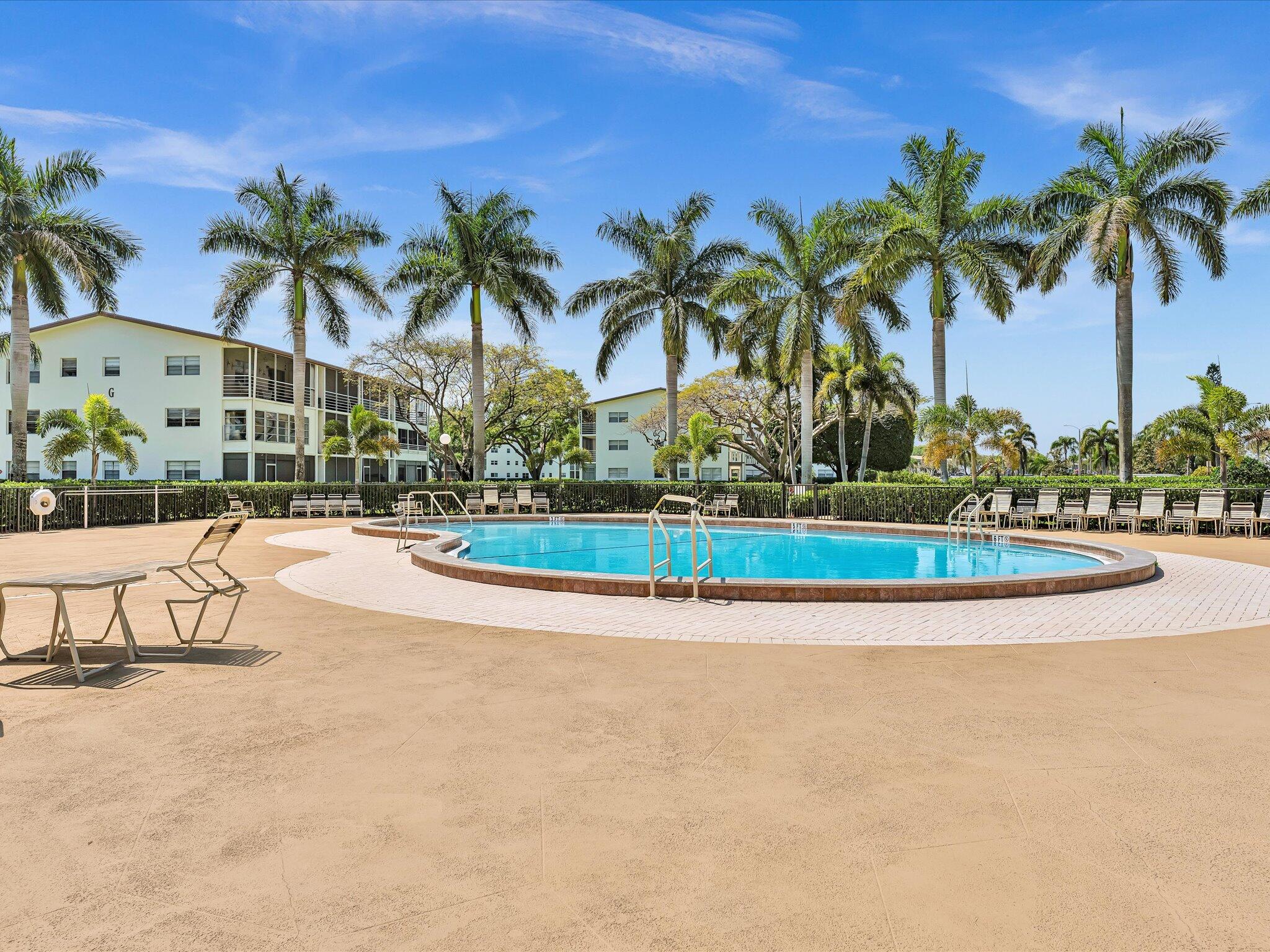 288 Fanshaw Drive, Unit G Boca Raton, FL 33434 - Photo 29 of 49 a view of outdoor space yard and palm tree